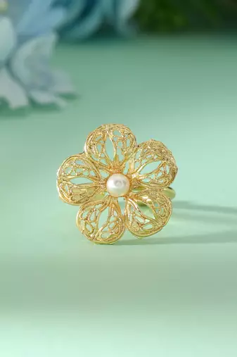 Gold color amrapali rings designed for sophisticated ethnic fashion with detailed artisanal work