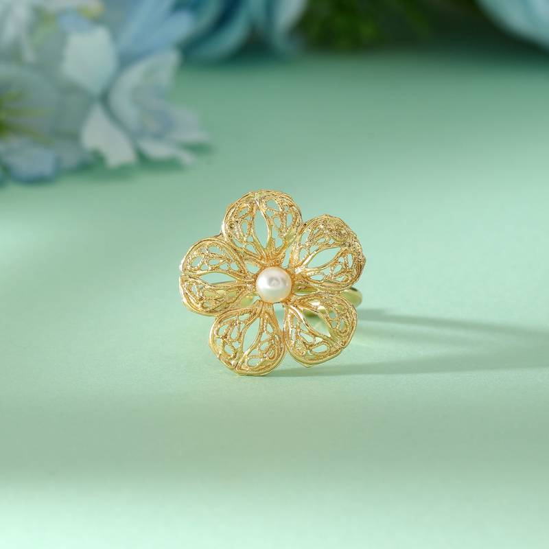 Gold color amrapali rings designed for sophisticated ethnic fashion with detailed artisanal work