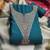 Teal color embroidered roman silk straight churidar dress material