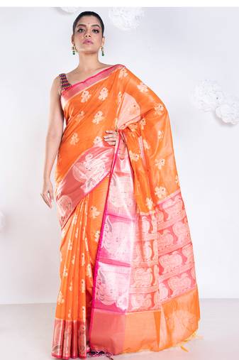 banarasi organza saree in burnt orange color with floral motifs and contrasting border