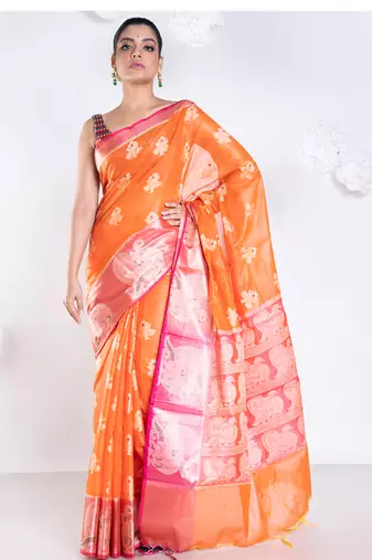 banarasi organza saree in burnt orange color with floral motifs and contrasting border