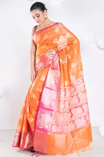 banarasi organza saree in burnt orange color with floral motifs and contrasting border