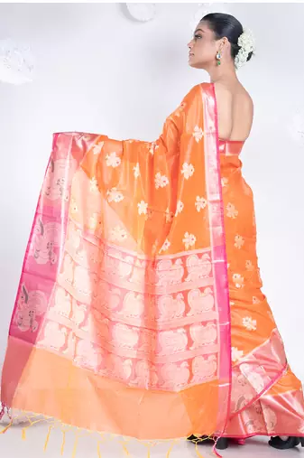 banarasi organza saree in burnt orange color with floral motifs and contrasting border
