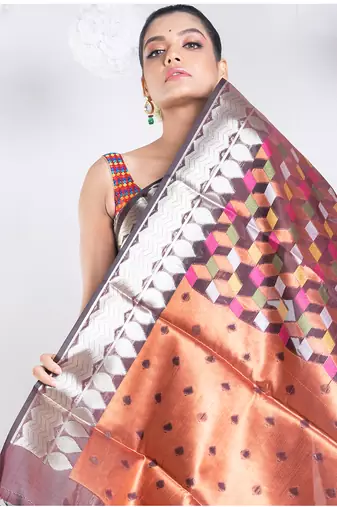 banarasi kora organza saree in chocolate brown color with multicolor motifs with copper zari