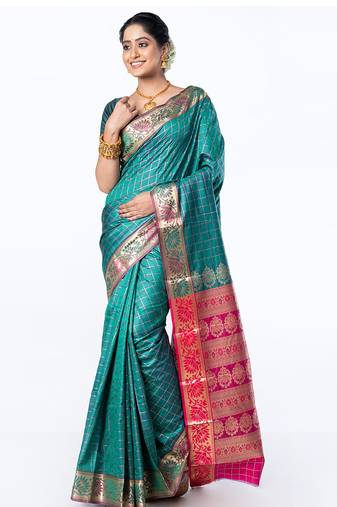 kanjivaram art silk saree in green color with zari checks and floral border