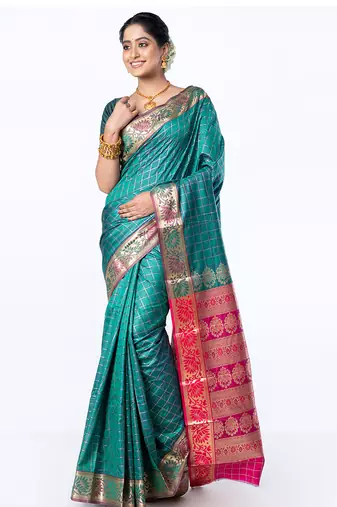 kanjivaram art silk saree in green color with zari checks and floral border