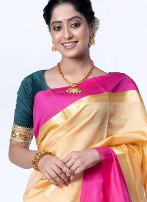 kanjivaram saree in beige color with contravention border and zari motifs 2