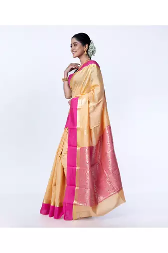 kanjivaram saree in beige color with contravention border and zari motifs