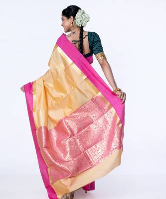 kanjivaram saree in beige color with contravention border and zari motifs 4
