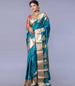 kanjivaram saree in blue color with golden border and booti