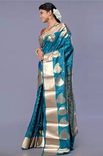 kanjivaram saree in blue color with golden border and booti