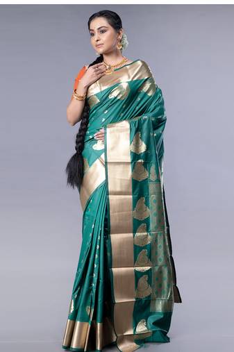 kanjivaram saree in bottle green color with golden border and booti