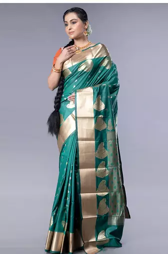 kanjivaram saree in bottle green color with golden border and booti