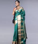 kanjivaram saree in bottle green color with golden border and booti