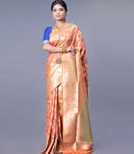 kanjivaram in tangerine orange color with zari floral jaal