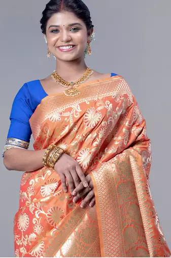 kanjivaram in tangerine orange color with zari floral jaal