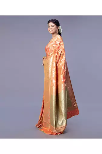 kanjivaram in tangerine orange color with zari floral jaal