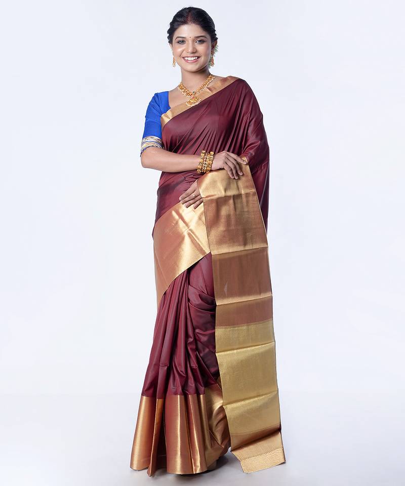 Kanjivaram saree in dark maroon color with golden mahapar border