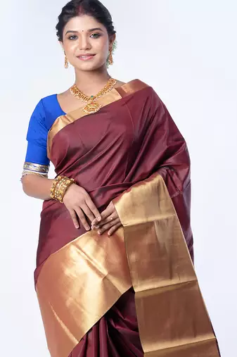 Kanjivaram saree in dark maroon color with golden mahapar border