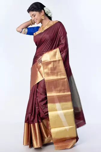 Kanjivaram saree in dark maroon color with golden mahapar border