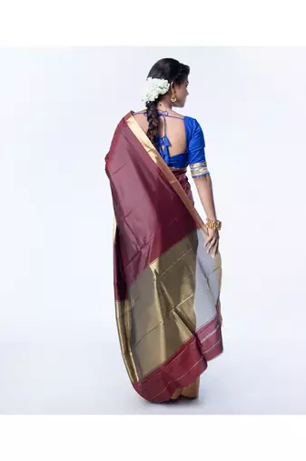 Kanjivaram saree in dark maroon color with golden mahapar border