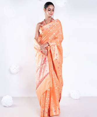 Banarasi kora organza saree in orange color with golden booti and border 1