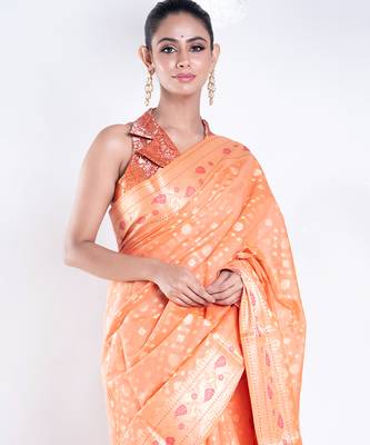 Banarasi kora organza saree in orange color with golden booti and border 2