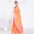 Banarasi kora organza saree in orange color with golden booti and border