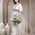 tribal sutra off white canvas floral embroidered handheld bag