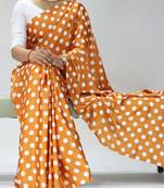 orange color polka dots print heavy japan satin saree with unstitched blouse