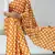 orange color polka dots print heavy japan satin saree with unstitched blouse