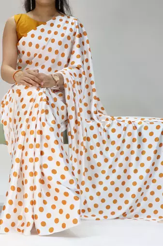 white color polka dots print heavy japan satin saree with unstitched blouse