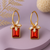Jewelz gold-plated red stone earrings with crystal floral accents
