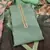 Green printed organza semi stitched churidar dress-materials