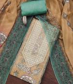 Green hand embroidery shimmer semi stitched churidar dress-materials