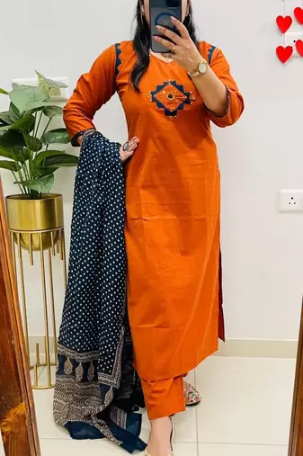 Floral embroidered orange v neck cotton kurta set with trouser & dupatta