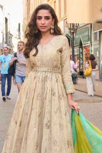 Light green simmar silk anarkali with thread & sequin work small motifs and detailed border.