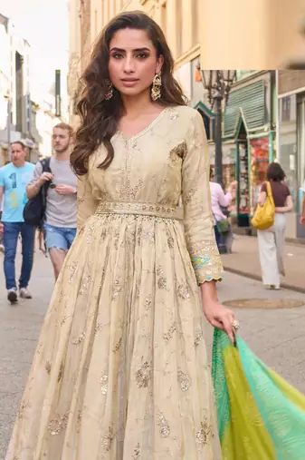 Light green simmar silk anarkali with thread & sequin work small motifs and detailed border.