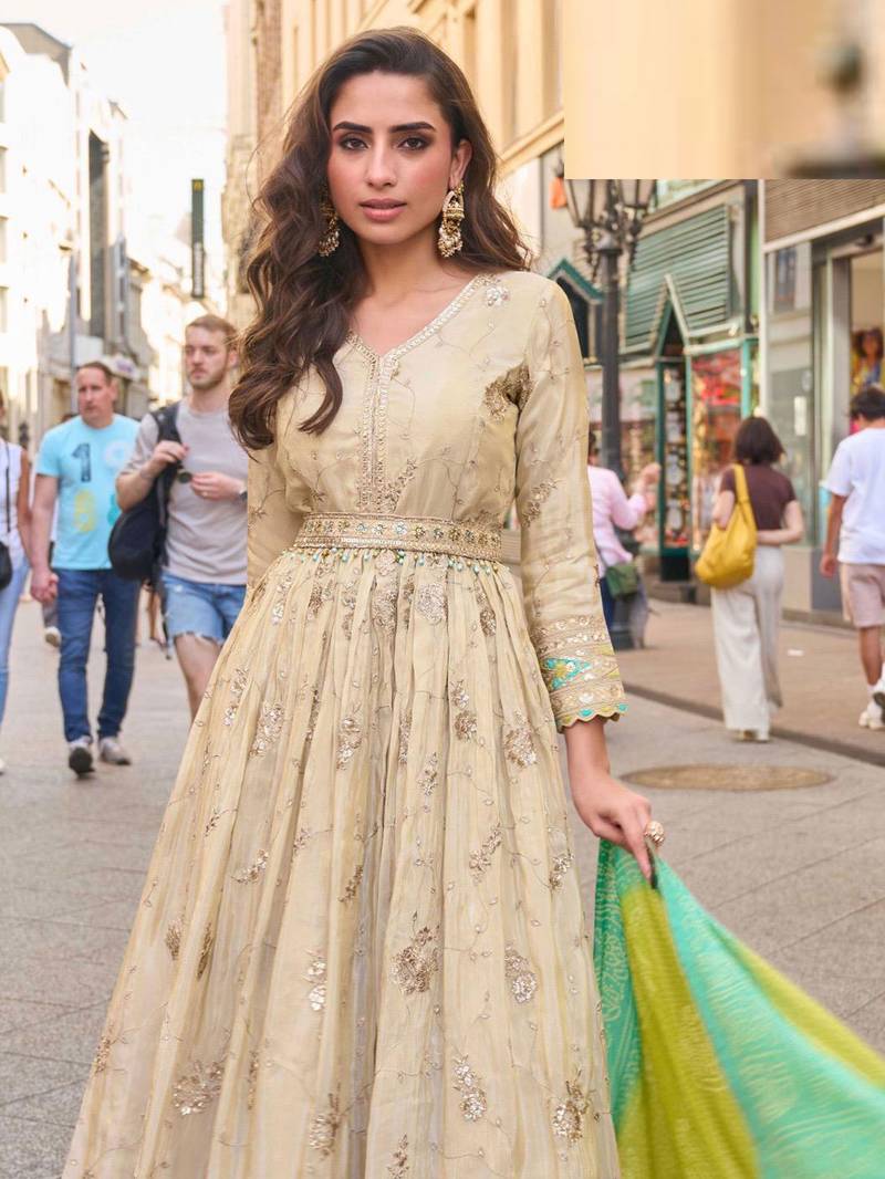 Light green simmar silk anarkali with thread & sequin work small motifs and detailed border.