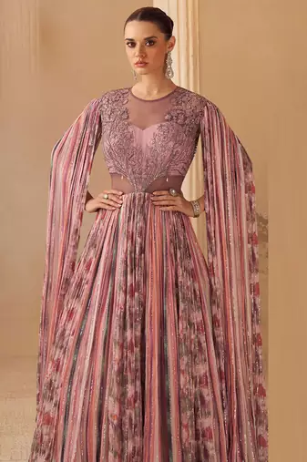 Dusty pink chinnon silk cape anarkali with golden zari thread floral embroidery and sequin detailing.