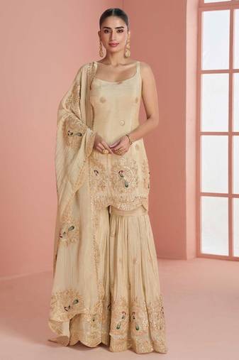 Light yellow chinnon silk straight top palazzo with zari, thread, motif and sequin work plus border.