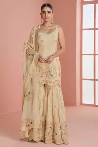 Light yellow chinnon silk straight top palazzo with zari, thread, motif and sequin work plus border.
