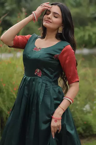 Green color banarasi jacquard weaving gown