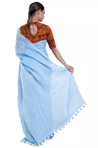 baby blue handloom linen saree with zari border and pallu