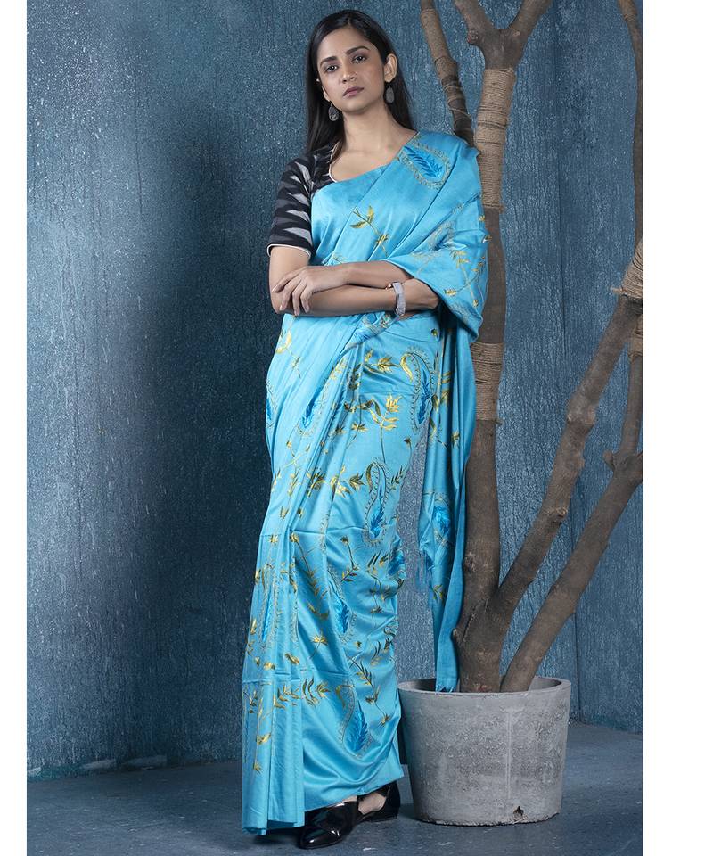 blue blended linen saree with green color floral embroidery