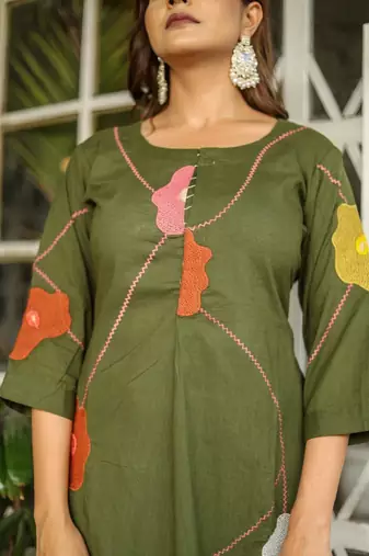 Beautiful jaipuri a green cotton kurta, pant, and dupatta set with floral applique designs and orange piping