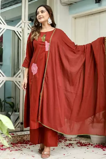 Beautiful jaipuri a rust orange cotton kurta, pant, and dupatta set with floral applique designs and orange piping.