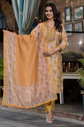 Beautiful jaipuri a yellow and white printed indian kurta set with a matching dupatta and pants.