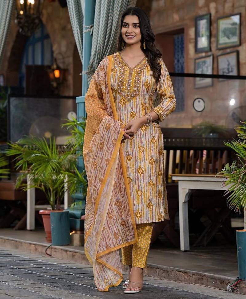 Beautiful jaipuri a yellow and white printed indian kurta set with a matching dupatta and pants.