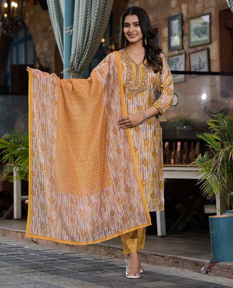 Beautiful jaipuri a yellow and white printed indian kurta set with a matching dupatta and pants.